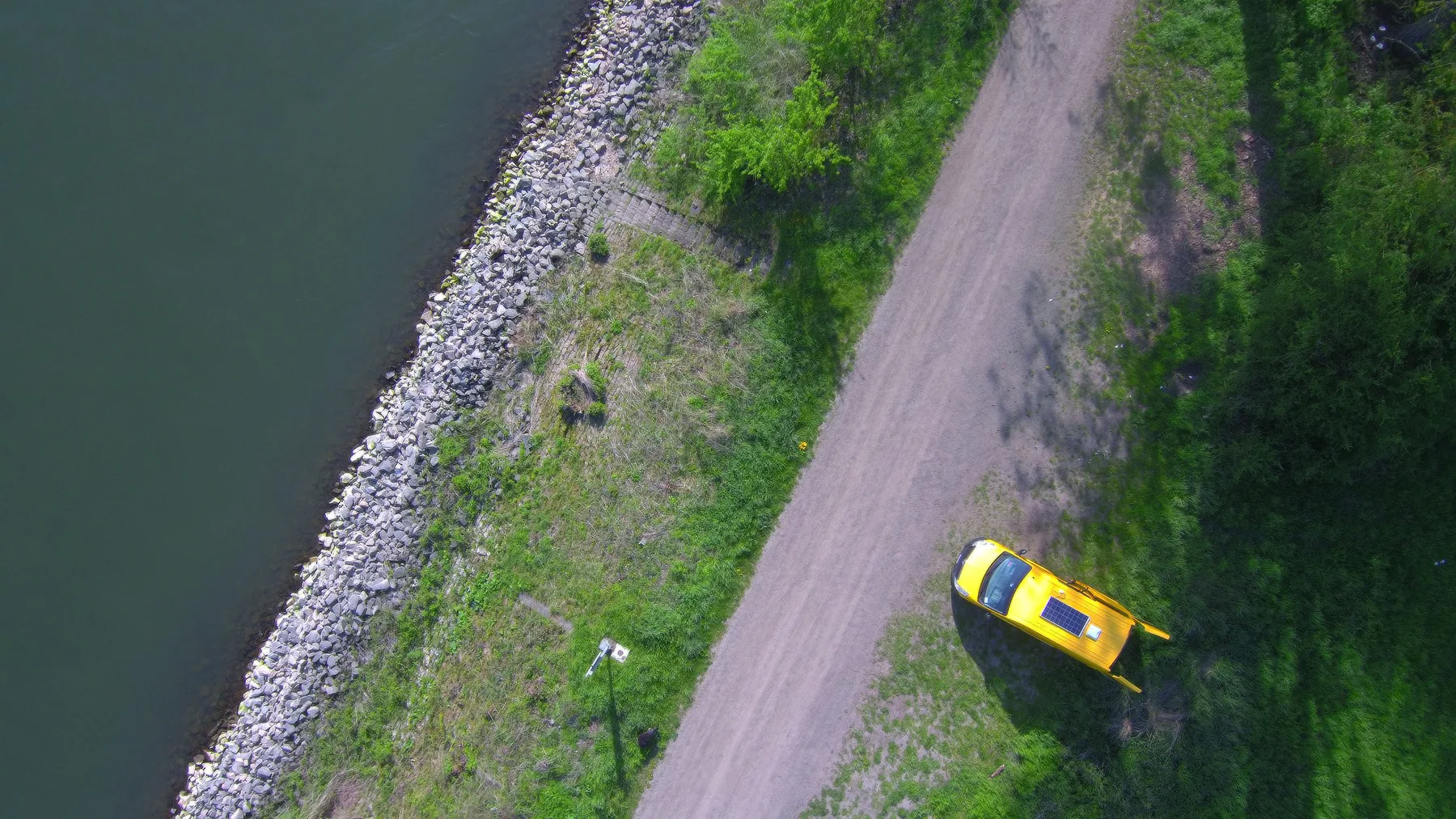 The converted Bumblebee van parked in a wide natural landscape